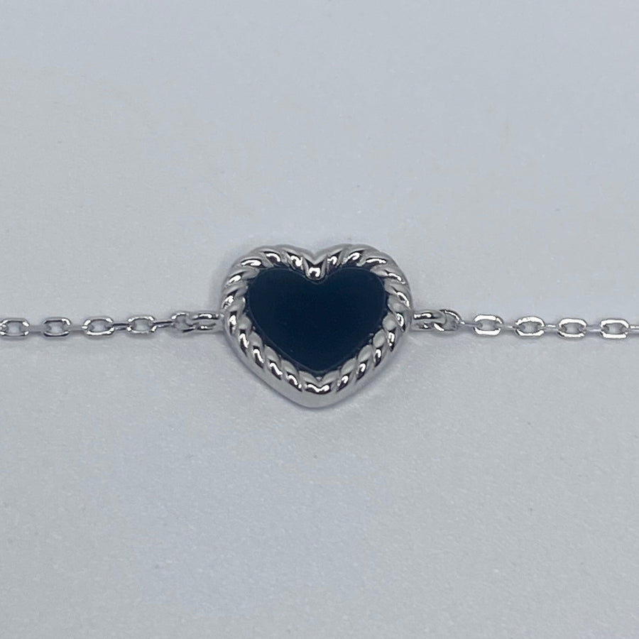7 inches Sterling silver bracelet with black enamel heart and cubic zirconia accents close up of heart
