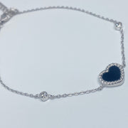 7 inches Sterling silver bracelet with black enamel heart and cubic zirconia accents side view