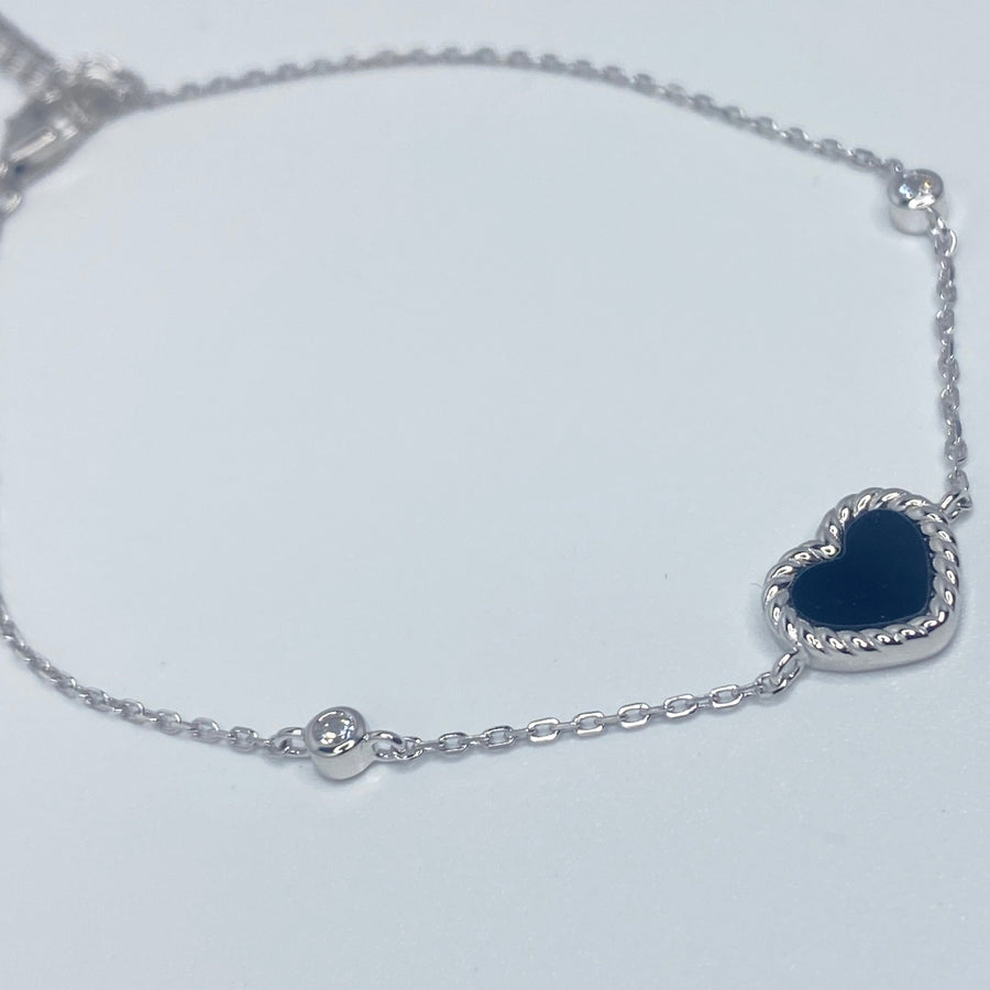 7 inches Sterling silver bracelet with black enamel heart and cubic zirconia accents side view