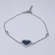 7 inches Sterling silver bracelet with black enamel heart and cubic zirconia accents front view