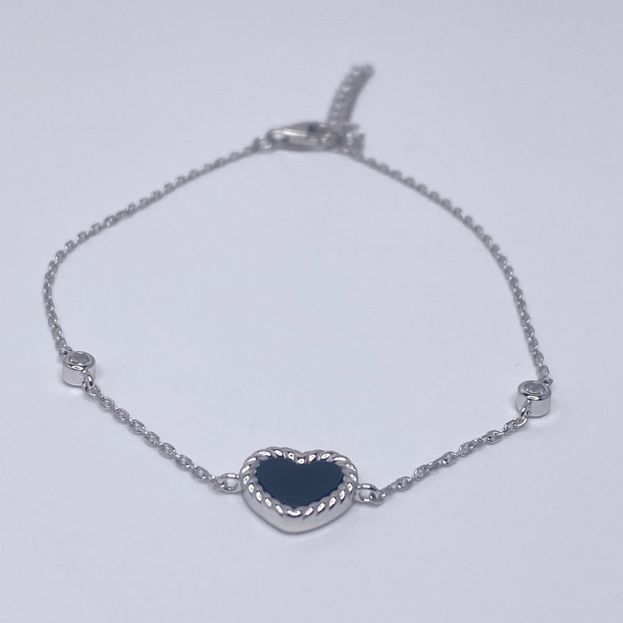 7 inches Sterling silver bracelet with black enamel heart and cubic zirconia accents front view