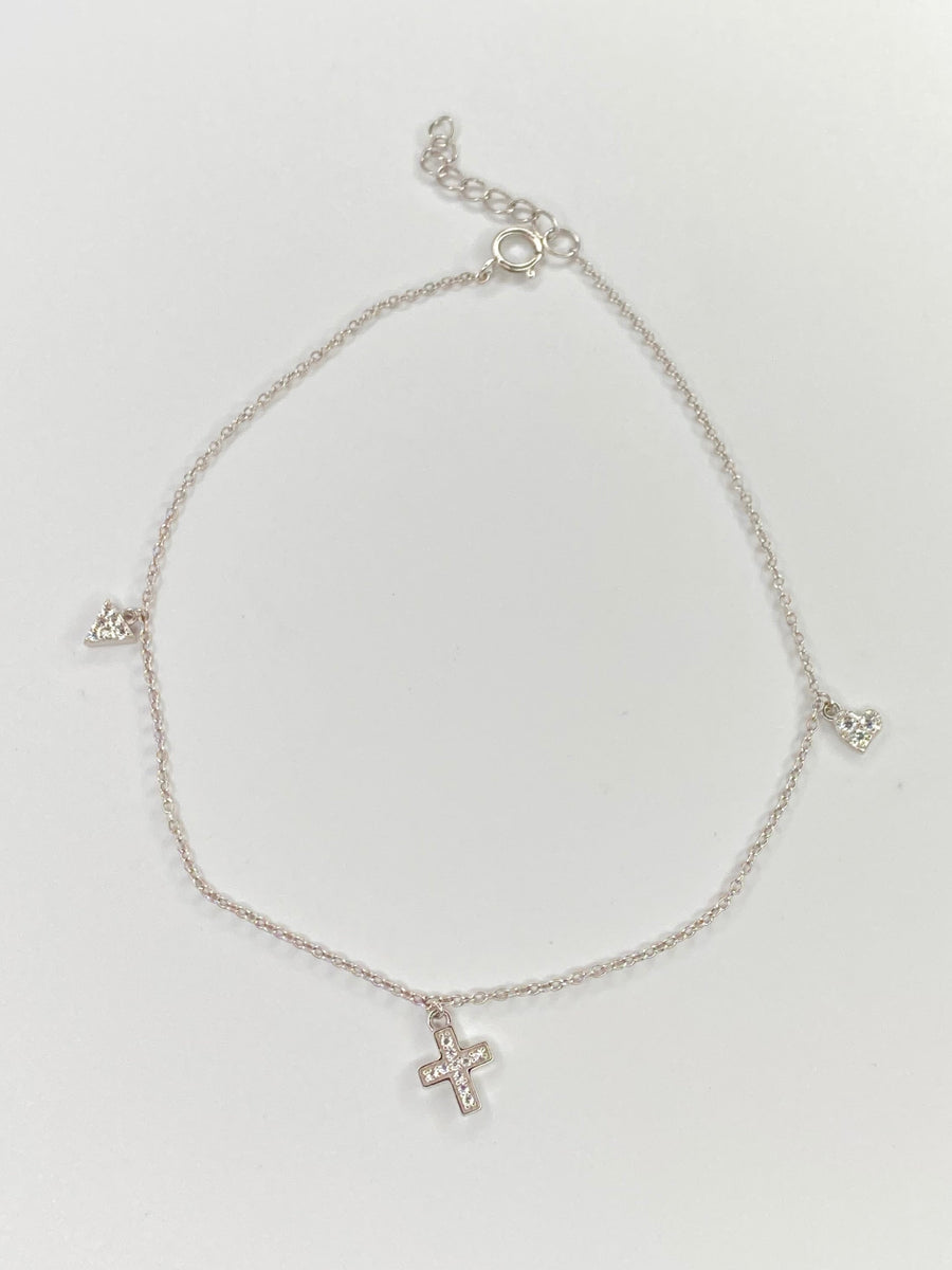 A delicate silver chain anklet with three small cross charms, displayed on a clean white background.