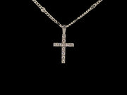 Moissanite cross pendant in a curb chain link with alternating diamond cut confetti link 