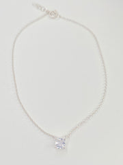 A delicate silver chain anklet with a single square-cut clear cubic zirconia pendant, displayed on a clean white background.